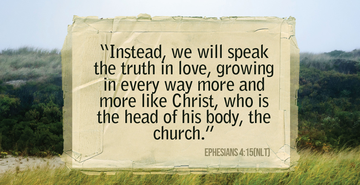 Beautiful green valley background with Ephesians 4:15 written across it