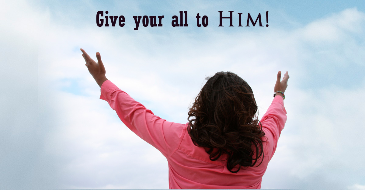 A Christian woman with arms open praising God