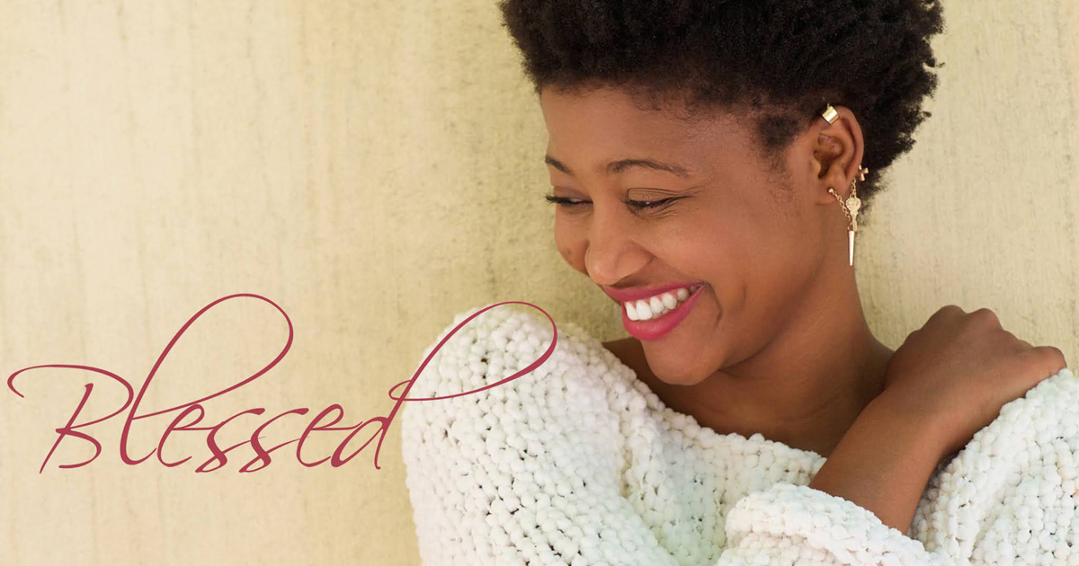 A beautiful woman smiling and feeling blessed